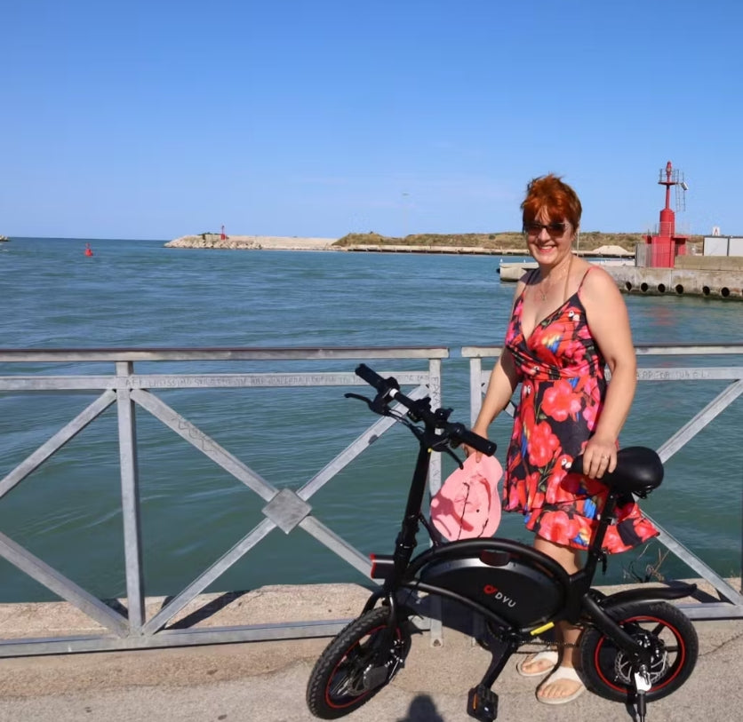 Dorota riding a folding electric bike