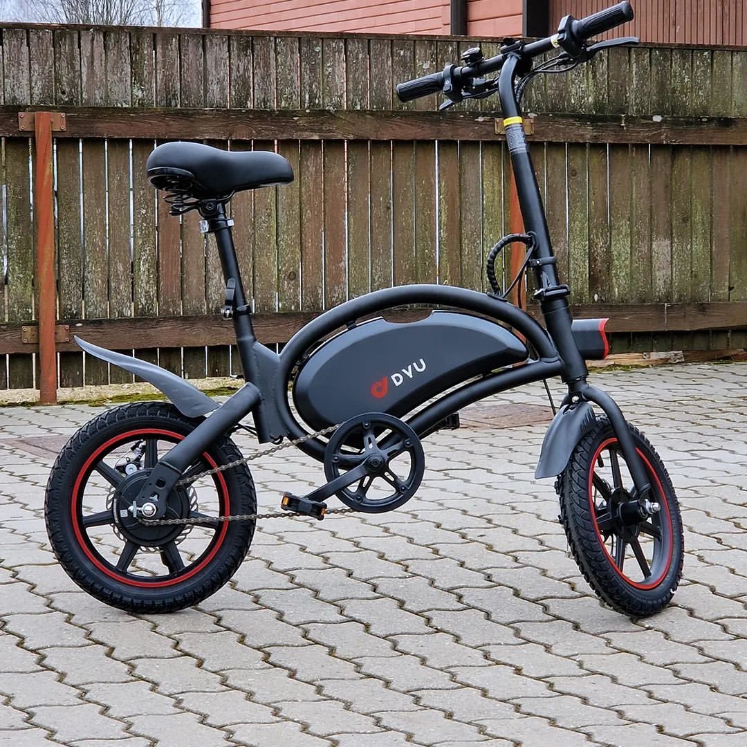 Elisabeth Dutranois is riding an electric bicycle on a dirt road