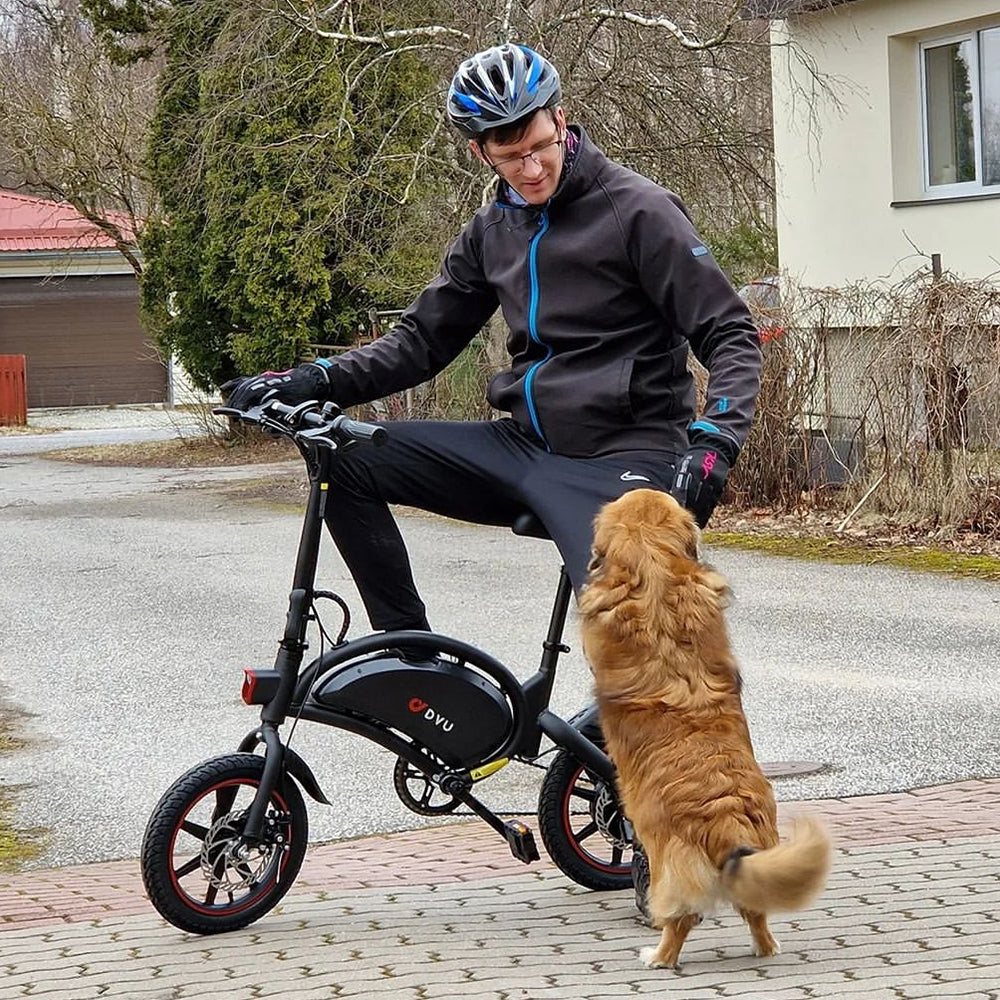 a man is riding e bike with his dog