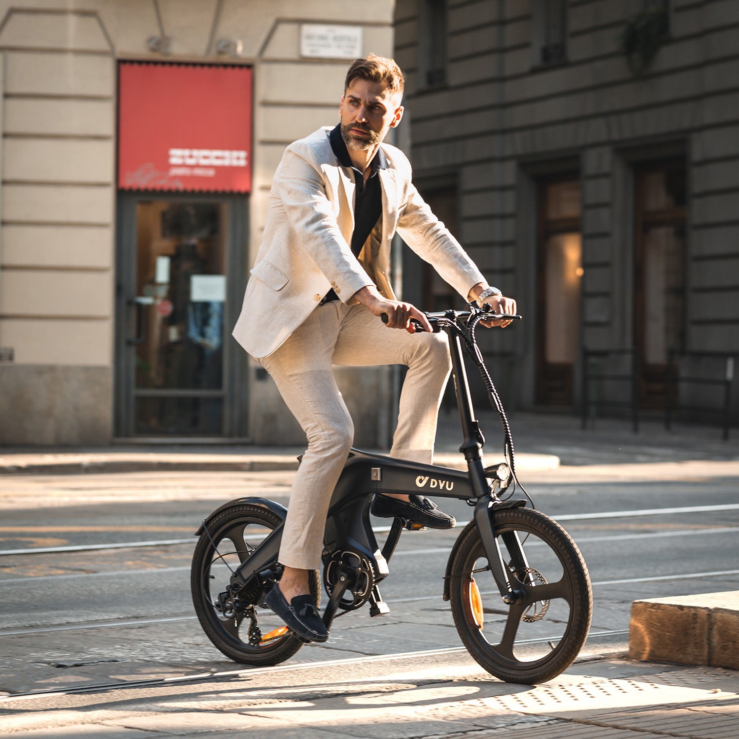 a man commuting on an electric bicycle.